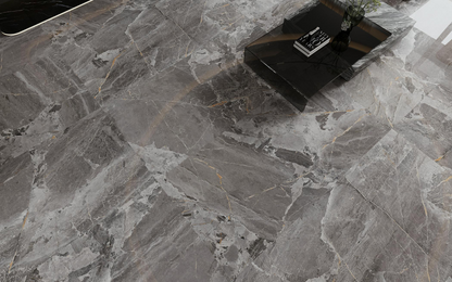 Dark colored ceramic tiles, marble tiles throughout the living room