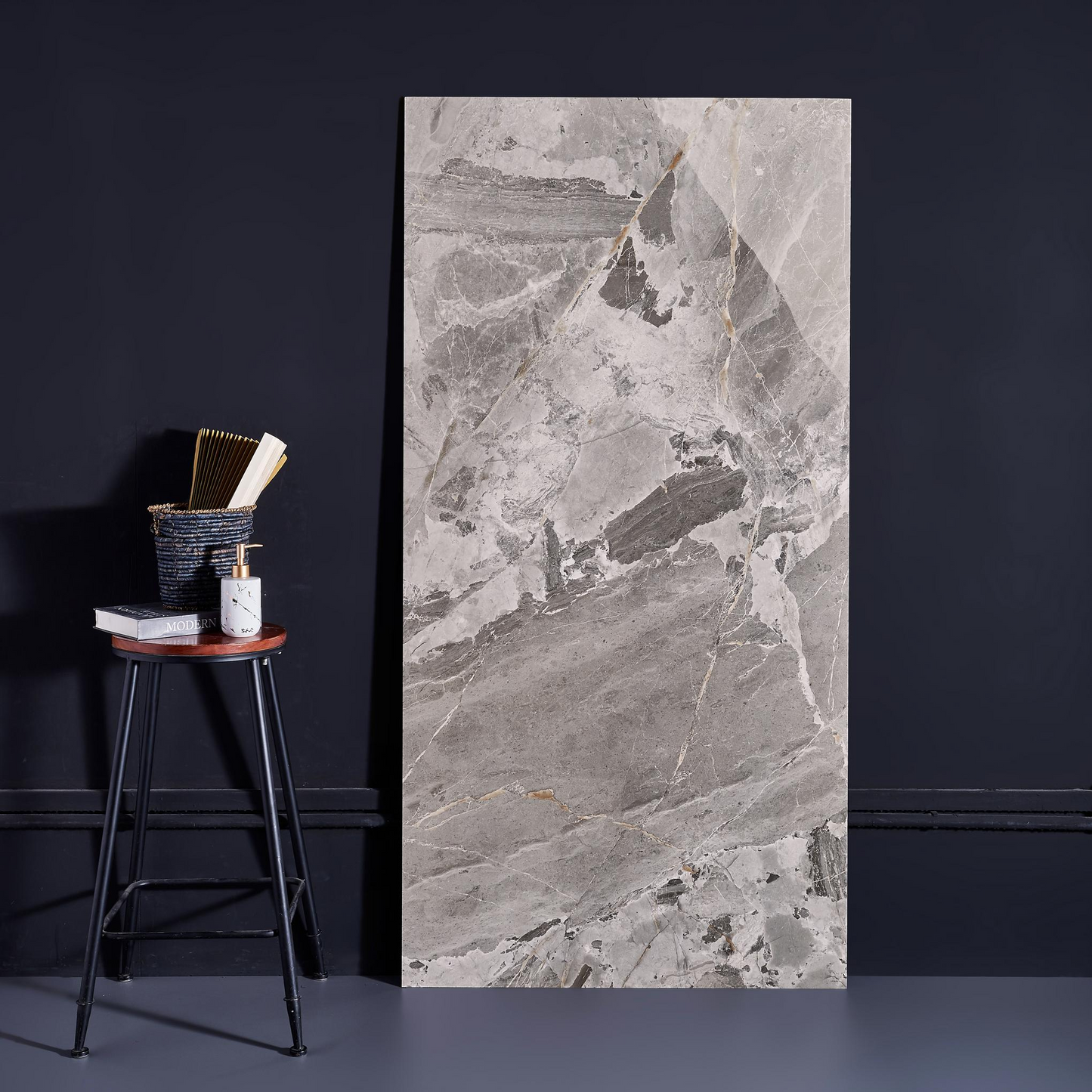 Dark colored ceramic tiles, marble tiles throughout the living room